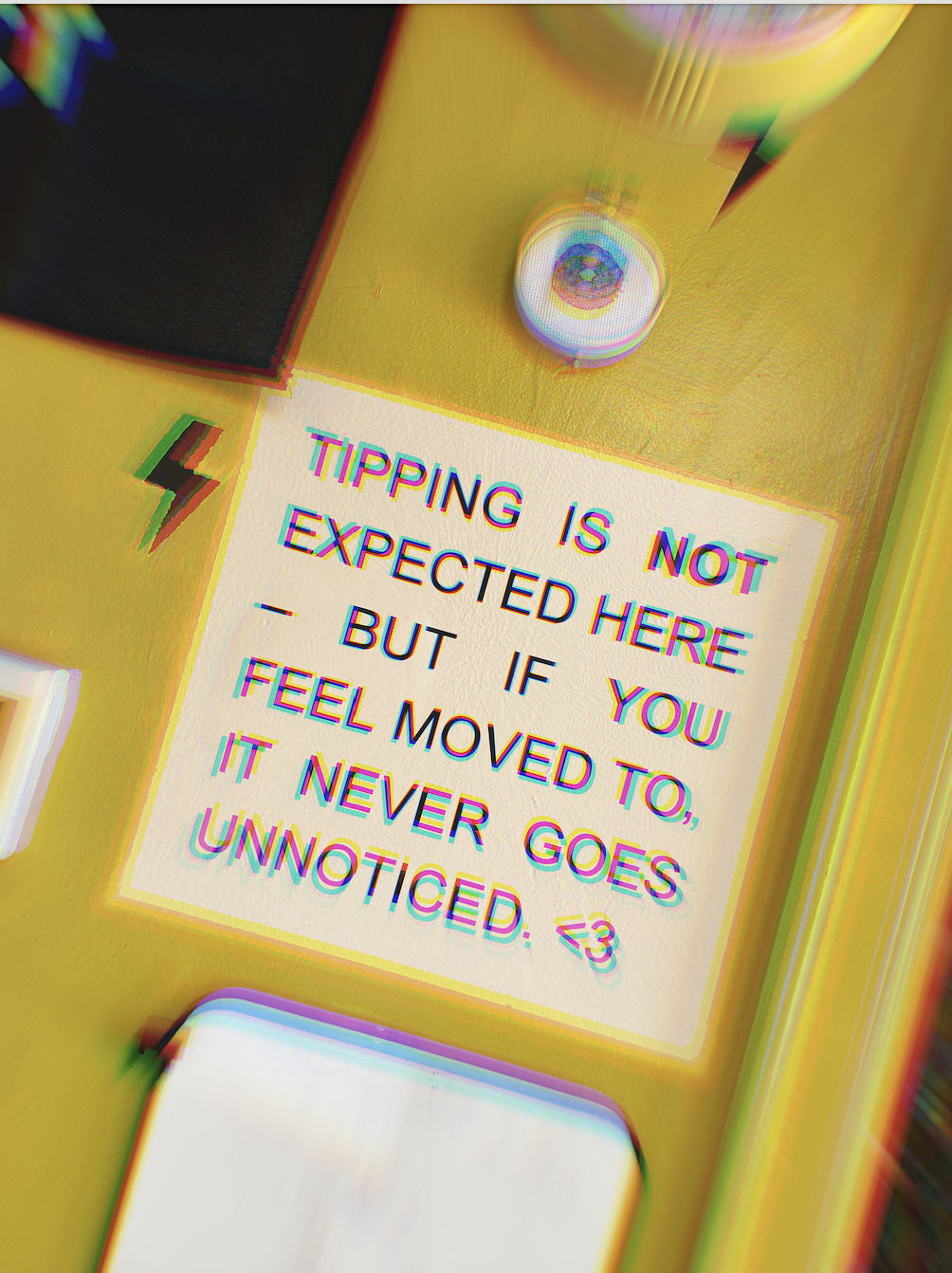 Sign at Inkvictus Studios in Raleigh explaining that clients don't have to tip their tattoo artist